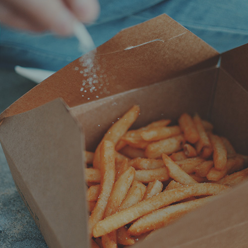 Photo of salt sprinkled on potato chips